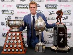 Connor McDavid of the Edmonton Oilers poses with the Art Ross Trophy, Hart Memorial Trophy and the Ted Lindsay Award after the 2017 NHL Awards at T-Mobile Arena in Las Vegas on Wednesday night.