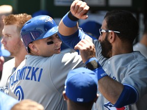 Troy Tulowitzki of the Toronto Blue Jays celebrates his home run with Jose Bautista in the second inning against the Kansas City Royals at Kauffman Stadium on June 24, 2017 in Kansas City.