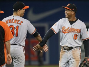 Ubaldo Jimenez  of the Baltimore Orioles celebrates their victory over the Blue Jays with Jonathan Schoop at Rogers Centre in Toronto on Thursday night.