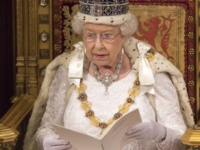 Queen Elizabeth II, reading from goatskin, delivers the Queen's Speech from the throne during State Opening of Parliament in the House of Lords at the Palace of Westminster on May 18, 2016 in London, England.