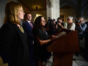 Treasury Board President Scott Brison is accompanied by the Minister of Democratic Institutions Karina Gould, the Minister of Justice and Attorney General of Canada Jody Wilson-Raybould as they make an announcement on Parliament Hill in Ottawa on Monday, June 19, 2017, regarding Access to Information.