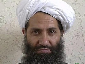 FILE - In this undated and unknown location photo, the new leader of the Afghanistan Taliban Maulvi Haibatullah Akhunzadah poses for a portrait. In a message ahead of the Muslim holiday of Eid al Fitr, the Taliban leader, Haibatullah Akhunzada Friday said a planned U.S. troop surge would not end the protracted war, vowing to fight on until a full withdrawal of NATO troops. (Afghan Islamic Press via AP)