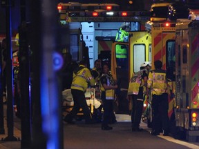 Members of the emergency services work at the scene of a terror attack on London Bridge in central London on June 3, 2017