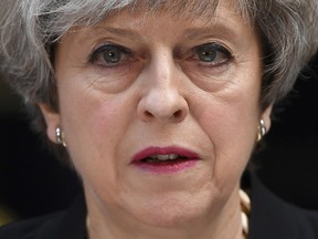 Britain's Prime Minister Theresa May delivers a statement outside 10 Downing Street in central London on June 4, 2017, following the June 3 terror attack
