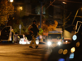 Australian police on June 5 shot dead a man who took the woman hostage in a Melbourne apartment, after the body of another man was found in the building's lobby.