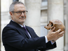 French paleoanthropologist Jean-Jacques Hublin poses with the casting of a skull of Homo Sapiens discovered in Morocco on June 6, 2017 in Paris.