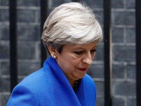 Britain's Prime Minister and leader of the Conservative Party Theresa May leaves 10 Downing Street in central London on June 9, 2017, en route to Buckingham Palace.