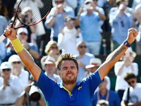 Switzerland's Stanislas Wawrinka celebrates after winning against Britain's Andy Murray their semifinal tennis match at the Roland Garros 2017 French Open on June 9, 2017 in Paris.