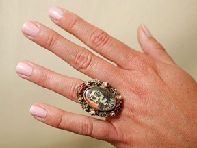 A model poses with an oval shaped ring designed by Pablo Picasso