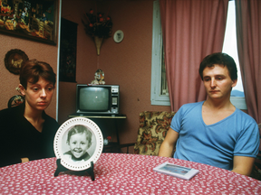 Christine and Jean-Marie Villemin in 1984, the parents of Gregory Villemin, who was found dead in the river, sitting in their living room next to a picture of their son in Epinal.