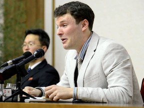 This file photo taken on February 29, 2016 and released by North Korea's official Korean Central News Agency (KCNA) on March 1, 2016 shows US student Otto Frederick Warmbier (R), who was arrested for committing hostile acts against North Korea, speaking at a press conference in Pyongyang.