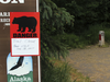 A sign warns people that the trail head is closed on Monday, June 19, 2017, after a fatal bear mauling at Bird Ridge Trail in Anchorage, Alaska.