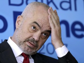 FILE - This is a Thursday, March. 16, 2016, file photo of Albanian Prime Minister Edi Rama as he gestures during press conference marking the end of a summit of Western Balkan leaders in Sarajevo, Bosnia. Albania holds parliamentary elections Sunday, June 25, 2017 a poll that will gauge the country's readiness to start European Union membership talks. ﻿﻿ Rama made his name as the man who updated the drab, communist-era look of the Albanian capital. Now he's seeking a second term as prime minister with the Socialist Party . ﻿﻿ (AP Photo/Amel Emric, File)