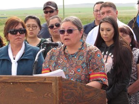 Deputy superintendent Annette Bruisedhead of the Blood Tribe in southern Alberta speaks to reporters in Standoff, Alta., on Thursday, June 22, 2017. A health board employee has been placed on administrative leave after a band member received a racial slur in a text message.