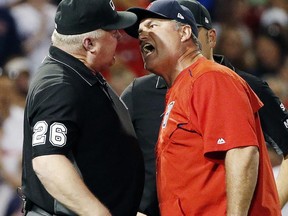 Boston Red Sox manager John Farrell, right, argues with third base umpire Bill Miller after a called balk during the seventh inning of a baseball game against the Los Angeles Angels, Saturday, June 24, 2017, in Boston. Farrell was ejected. (AP Photo/Michael Dwyer)