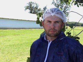 In this Tuesday, June 20, 2017, image made from a video, Bret Hendricks, a broiler manager for Tyson Foods speaks outside a chicken house in Plumerville, Ark. Hendricks is responsible for millions of chickens kept at farms near a company processing plant in nearby Dardanelle, Ark. Tyson is launching an effort to ensure the birds are handled properly and will explore ways to slaughter chickens in a more-humane way. (AP Photo/Kelly P. Kissel)