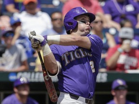 LSU's Michael Papierski (2) follows through on his three-run home run against Oregon State in the third inning of an NCAA College World Series baseball elimination game in Omaha, Neb., Saturday, June 24, 2017. (AP Photo/Nati Harnik)