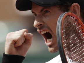Britain's Andy Murray clenches his fist after a winning point as he plays Slovakia's Martin Klizan during their second round match of the French Open tennis tournament at the Roland Garros stadium, Thursday, June 1, 2017 in Paris. Murray won 6-7, 6-2, 6-2, 7-6.