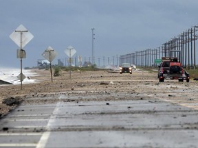 Debris covers TX-87 as a result of Tropical Storm Cindy on Thursday, June 22, 2017, in Bolivar Peninsula, Texas. (Elizabeth Conley/Houston Chronicle via AP)