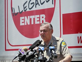 FILE-In this Thursday, July 29, 2010 file photo, Maricopa County Sheriff Joe Arpaio speaks in Phoenix announcing his crime suppression sweeps. The former longtime sheriff of metro Phoenix will go to court Monday, June 26, 2017, to defend his reputation at a trial in which he's charged with purposefully disobeying a judge's order. Arpaio is charged with criminal contempt-of-court for prolonging his immigration patrols 17 months after a judge ordered them stopped. (AP Photo/Matt York, File)