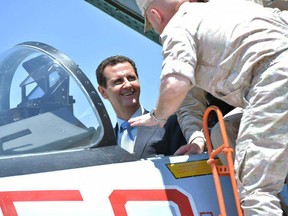 President Bashar al-Assad sitting inside a Sukhoi Su-27 during his visit to the Hmeimim military base in Latakia province, in the northwest of Syria.
