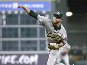 Oakland Athletics starting pitcher Jesse Hahn throws against the Houston Astros during the first inning of a baseball game, Wednesday, June 28, 2017, in Houston. (AP Photo/David J. Phillip)
