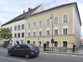 FILE - This Sept. 27, 2012 file picture shows an exterior view of Adolf Hitler's birth house, front, in Braunau am Inn, Austria.  A lawyer for the owner of the house where Adolf Hitler was born is disputing the government's right to take possession of the property in Austria's highest court Thursday June 22, 2017,  saying authorities are using the measure "like a club" because his client refused purchase offers from authorities that were too low. The challenge is in response to a government bill to expropriate the house after owner Gerlinde Pommer refused to sell it. Hitler was born in 1889 in the house in Braunau am Inn, a town on the German border (AP Photo / Kerstin Joensson, File)