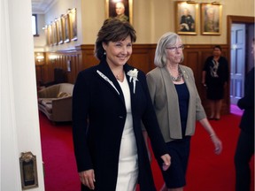 Premier Christy Clark arrives with Lieutenant-Governor Judith Guichon for a swearing-in ceremony for the provincial cabinet at Government House in Victoria, B.C., on Monday, June 12, 2017. THE CANADIAN PRESS/Chad Hipolito ORG XMIT: CAH102