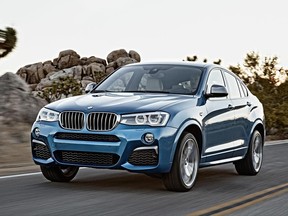 This photo provided by BMW shows the 2016 BMW X4 M40i. With SUVs growing in popularity, BMW adds a top X4 compact SUV, the M40i, that sheds typical SUV characteristics and replaces them with sports car power and handling. (www.danielkraus.de/BMW via AP)