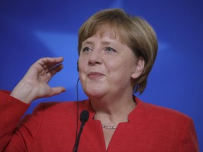 FILE - A Friday, June 23, 2017 file photo of German Chancellor, Angela Merkel, speaking during a media conference at an EU summit in Brussels. Merkel said Monday, June 26, 2017, that she doesn't really do Twitter, but sometimes visits the site to check out what U.S. President Donald Trump has to say. (AP Photo/Olivier Matthys, File)