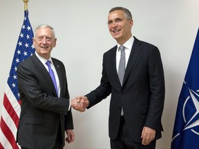 U.S. Secretary for Defense Jim Mattis, left, shakes hands with NATO Secretary General Jens Stoltenberg prior to a meeting at NATO headquarters in Brussels on Thursday, June 29, 2017. NATO defense ministers meet Thursday to discuss, among other issues, the situation in Afghanistan and defense spending. (AP Photo/Virginia Mayo, Pool)