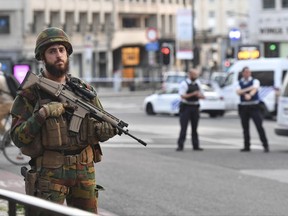 A Belgian Army soldier stands outside Central Station after a reported explosion in Brussels on Tuesday, June 20, 2017.
