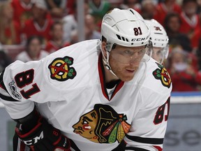 FILE - In this Saturday, March 25, 2017, file photo, Chicago Blackhawks right wing Marian Hossa (81) prepares for a face off against the Florida Panthers during the first period of an NHL hockey game, in Sunrise, Fla. Hossa will miss the entire 2017-18 NHL season because of a progressive skin disorder, the team announced the news early Wednesday, June 21, 2017. (AP Photo/Joel Auerbach, File)