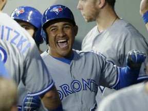 Toronto Blue Jays' Ezequiel Carrera reacts in the dugout after he hit a home run during the eighth inning against the Mariners Saturday in Seattle.