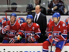 Interim head coach Bob Gainey works the bench behind Montreal Canadiens captain Saku Koivu.