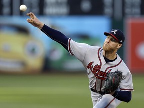 Atlanta Braves pitcher Mike Foltynewicz works against the Oakland Athletics during the first inning of a baseball game Friday, June 30, 2017, in Oakland, Calif. (AP Photo/Ben Margot)