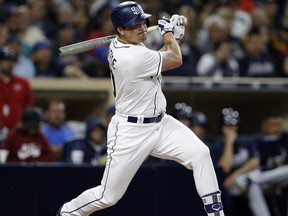 San Diego Padres' Hunter Renfroe watches his two-run triple during the fourth inning of the team's baseball game against the Atlanta Braves in San Diego, Wednesday, June 28, 2017. (AP Photo/Alex Gallardo)