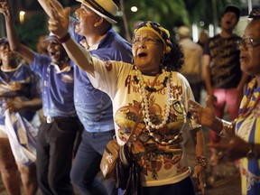 Samba school members sing outside City Hall to protest Rio de Janeiro's Mayor Marcelo Crivella's decision to cut carnival funding, in Rio de Janeiro, Brazil, Monday, June 26, 2017. In office since January 2017, Crivella had won the support of the samba schools during last year's election with promises of increased public investment. (AP Photo/Liliana Michelena)