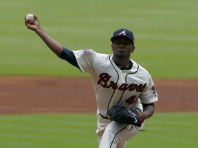 Atlanta Braves starting pitcher Julio Teheran (49) throws against the Milwaukee Brewers during the first inning of a baseball game, Sunday, June 25, 2017, in Atlanta, Ga. (AP Photo/Butch Dill)