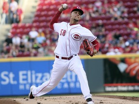 Cincinnati Reds' Louis Castillo pitches against the Milwaukee Brewers in the first inning of a baseball game, Wednesday, June , 28 2017, in Cincinnati. (AP Photo/Tony Tribble)