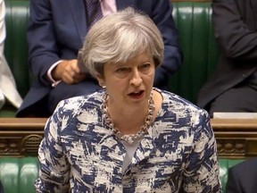 British Prime Minister Theresa May makes a statement on the European Council to members in the House of Commons, London, Monday June 26, 2017.  Theresa May  told Parliament Monday that steps will be taken to make sure the Brexit split with the EU is handled with care for the estimated 3 million EU citizens currently living inside Britain. (/PA via AP)