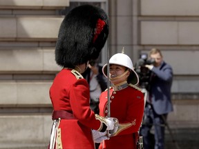 Canadian Captain Megan Couto, right, makes history by becoming the first female Captain of the Queen's Guard