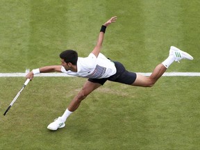 Serbia's Novak Djokovic in action during his match against Donald Young of the United States at the AEGON International tennis tournament  at Devonshire Park, Eastbourne, England Thursday June 29, 2017. (Gareth Fuller/PA via AP)