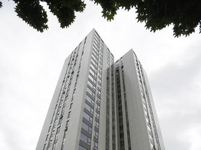 A view of Burnham residential tower on the Chalcots Estate showing the bottom section of the building after cladding  was removed, in the borough of Camden, north London, Thursday, June 22, 2017. Tests so far have found that at least three high-rise apartment buildings in the U.K. have flammable external panels like the ones believed to have contributed to a fire that killed 79 people in London, Britain's government said Thursday. The local council in Camden, a borough of London, removed cladding from one of its buildings for further testing after tests they commissioned showed some of their panels were of the flammable variety -- and not the ones they ordered.﻿ It was unclear whether the Camden example was one of the three mentioned by the government.  (AP Photo/Matt Dunham)