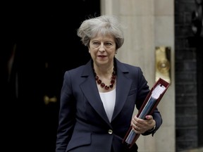 British Prime Minister Theresa May leaves 10 Downing Street in London, to attend Prime Minister's Questions at the Houses of Parliament, Wednesday, June 28, 2017. (AP Photo/Matt Dunham)