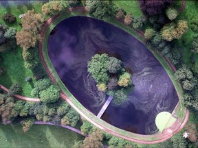 FILE - A Friday, Sept. 5, 1997 aerial photo taken from files of the island where Princess Diana is buried in the grounds of the Spencer family estate in Althorp, England, near Northampton north of London. Prince William, his wife, Kate, and Prince Harry will attend a private service at the late Princess Diana's grave on what would have been her 56th birthday. In a brief statement, Kensington Palace said Wednesday, June 28, 2017, that the July 1 service will be conducted by the Archbishop of Canterbury and attended by Diana's family. (AP Photo/Jerome Delay, File)