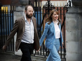 Prime Minister Theresa May's chief of staff Nick Timothy and Joint-chief of staff Fiona Hill leave Conservative Party headquarters in London, Friday, June 9, 2017.