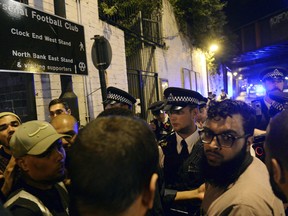 Police officers talk with local people at Finsbury Park in north London, where one person has been arrested after a vehicle struck pedestrians, leaving "a number of casualties."