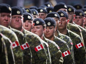 Members of the Canadian Armed Forces march during the Calgary Stampede parade on Friday, July 8, 2016.