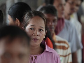 Cambodian villagers line up to enter a courtroom before the hearings against two former Khmer Rouge senior leaders, at the U.N.-backed war crimes tribunal on the outskirts of Phnom Penh, Cambodia, Friday, June 23, 2017. The U.N.-backed tribunal on Friday held its closing statement in case 002/02 against the Khmer Rouge leaders Khieu Samphan and Nuon Chea. The men are charged with a range of crimes including genocide, murder, rape and enslavement. (AP Photo/Heng Sinith)